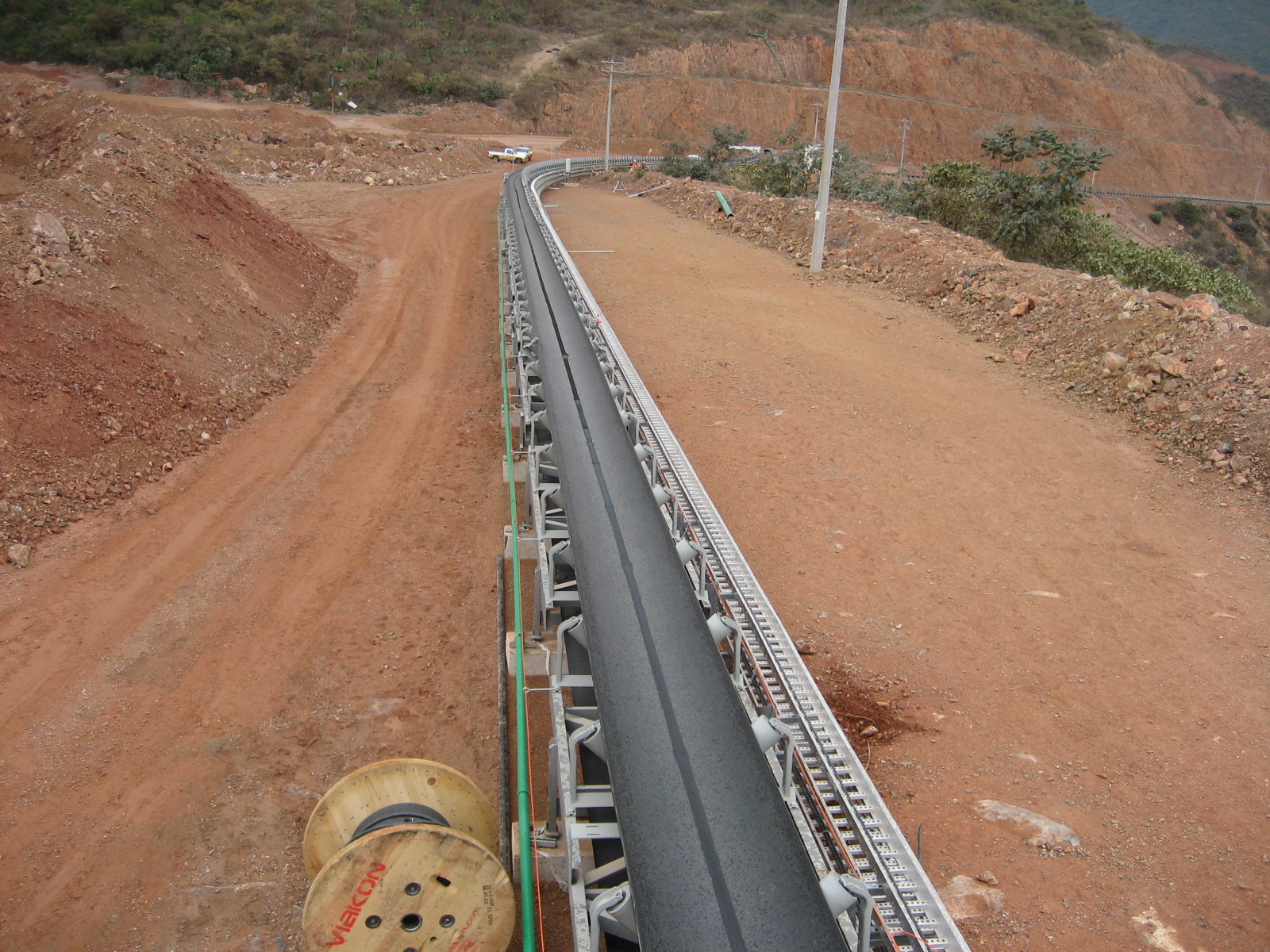 DSI Horizontally Curving Downhill Regenerative Overland Conveyor TB-28 for Los Filos, Goldcorp - 300m radius-image